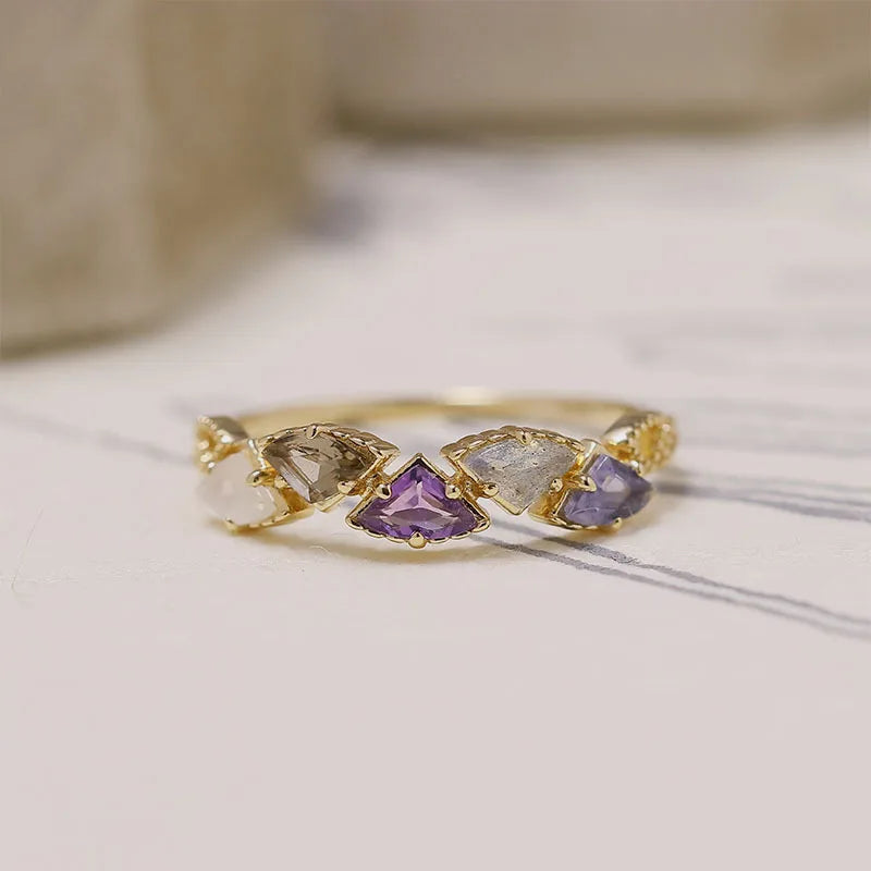 multi-stone gemstone ring with natural purple blue and neutral toned stones