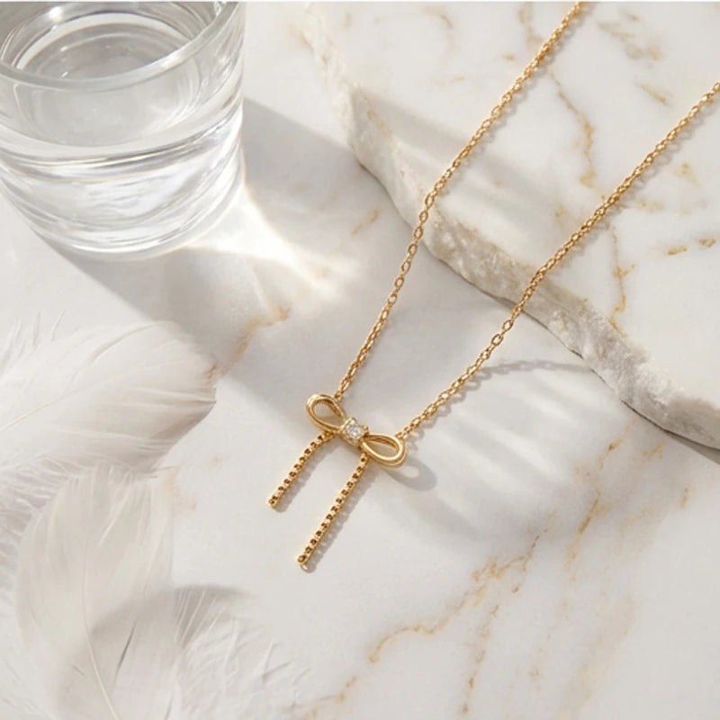 Moissanite necklace with sculptural bow design