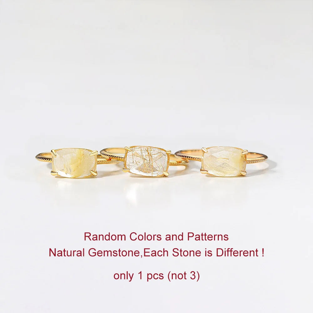 Three gold rings with natural Quartz gemstones on a white background, text indicating random colors and patterns.