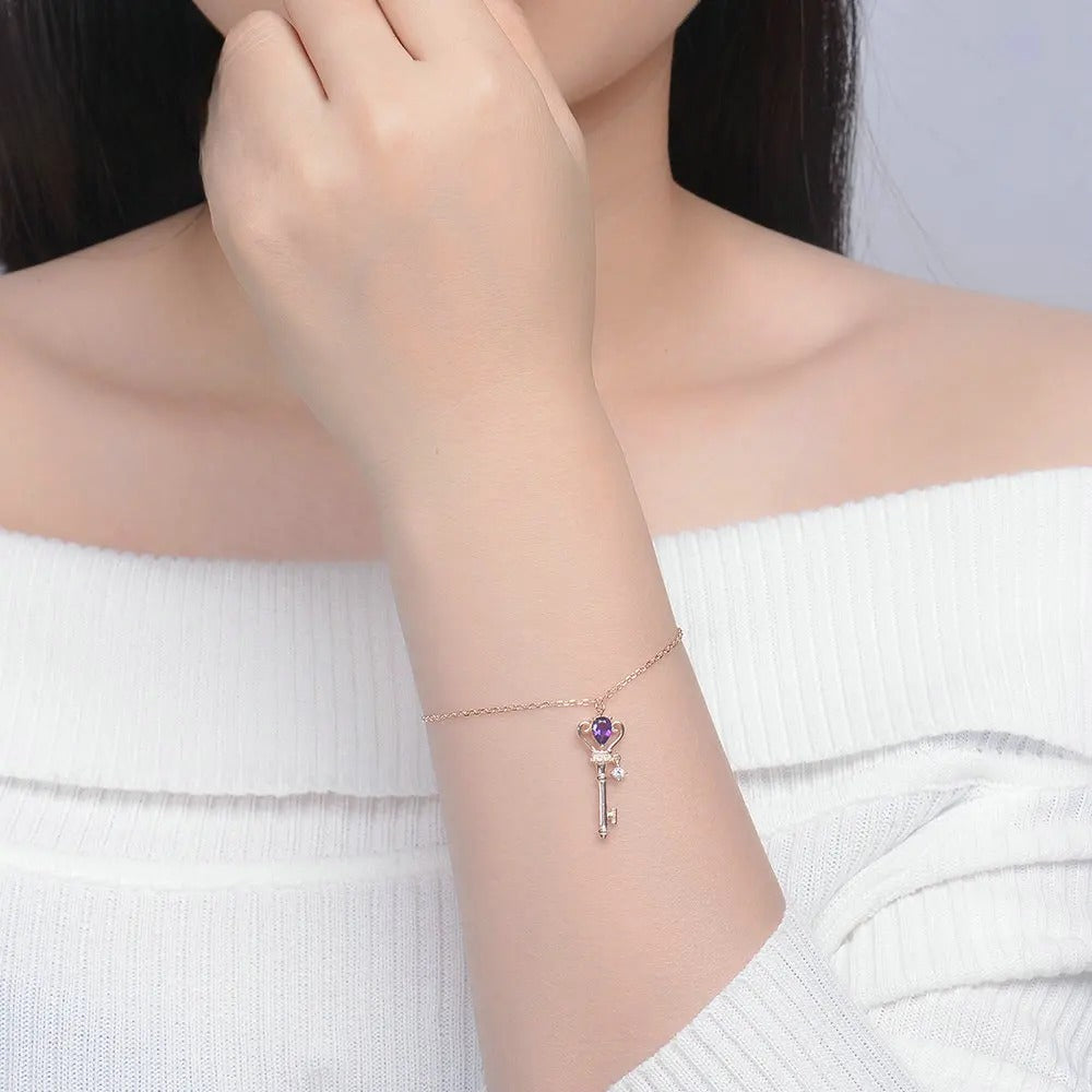 Close-Up of Amethyst Key Bracelet in Rose Gold Finish with Adjustable Chain