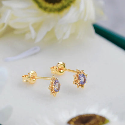 Natural tanzanite stud earrings with blue-violet stones in gold plated silver