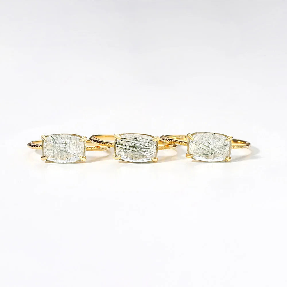 Quartz rings with four gemstones on a white background
