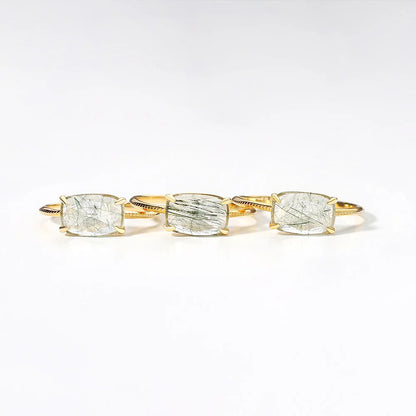 Quartz rings with four gemstones on a white background