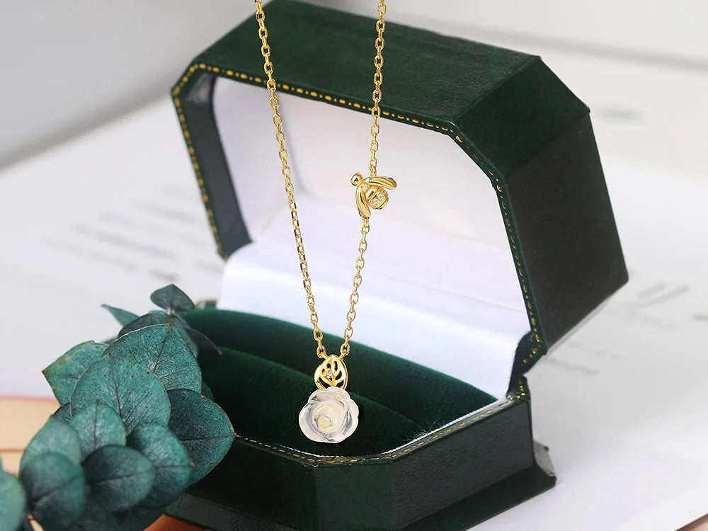 Close-Up of Rose Quartz Pendant Necklace with Gold Chain