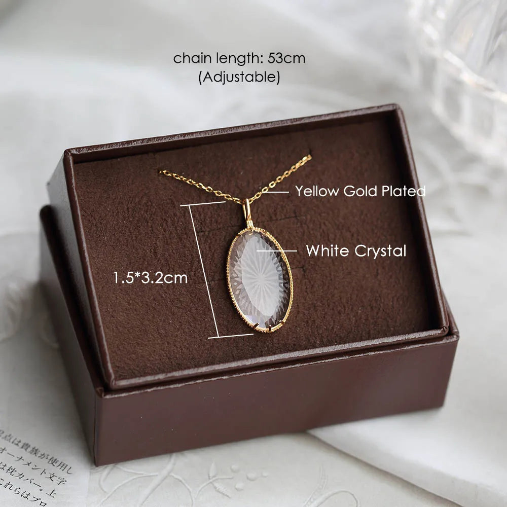 natural white crystal necklace with oval pendant in jewelry box
