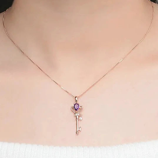 Close-Up of Teardrop Amethyst Crown Key Pendant in Rose Gold Finish