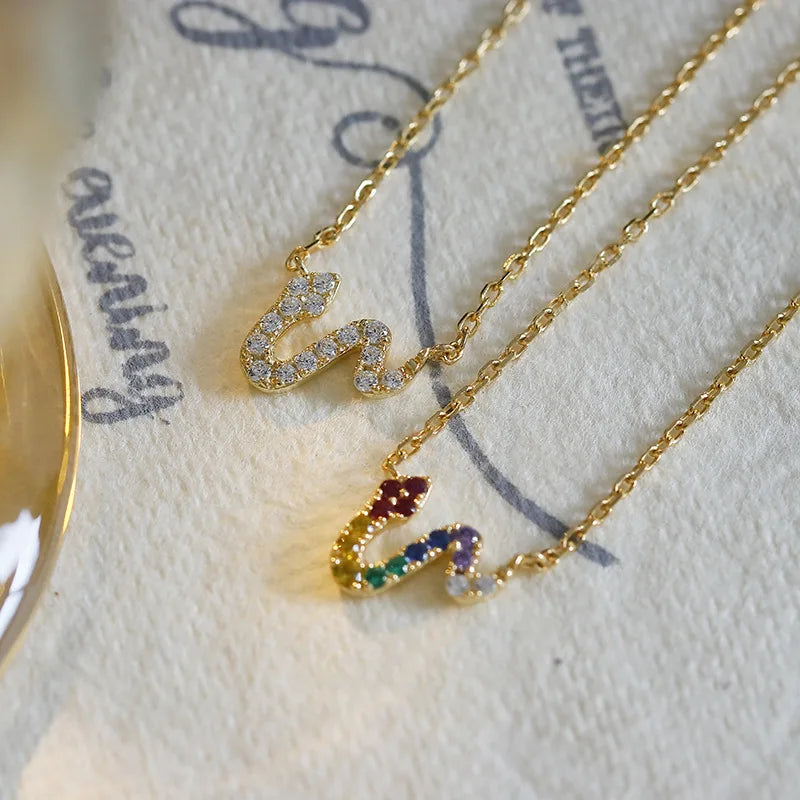 colourful serpent pendant necklace displayed with jewelry