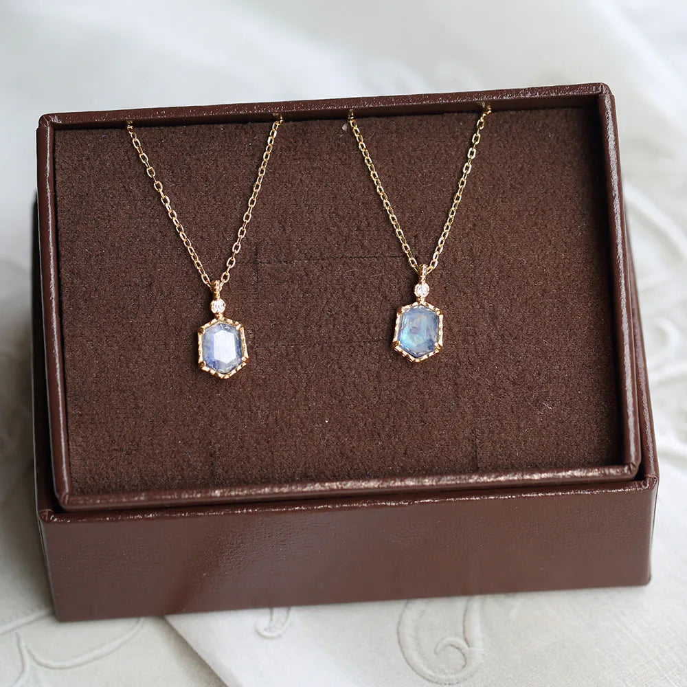 Natural moonstone pendant necklace displayed on a jewelry stand