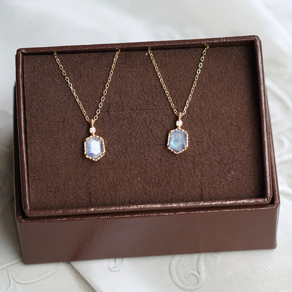 Natural moonstone pendant necklace displayed on a jewelry stand