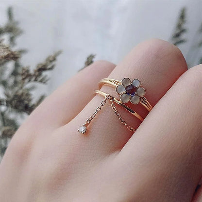 Natural iolite and agate flower ring worn on finger