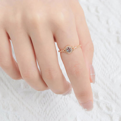 Lab-created alexandrite ring worn on hand in 14K gold plated silver