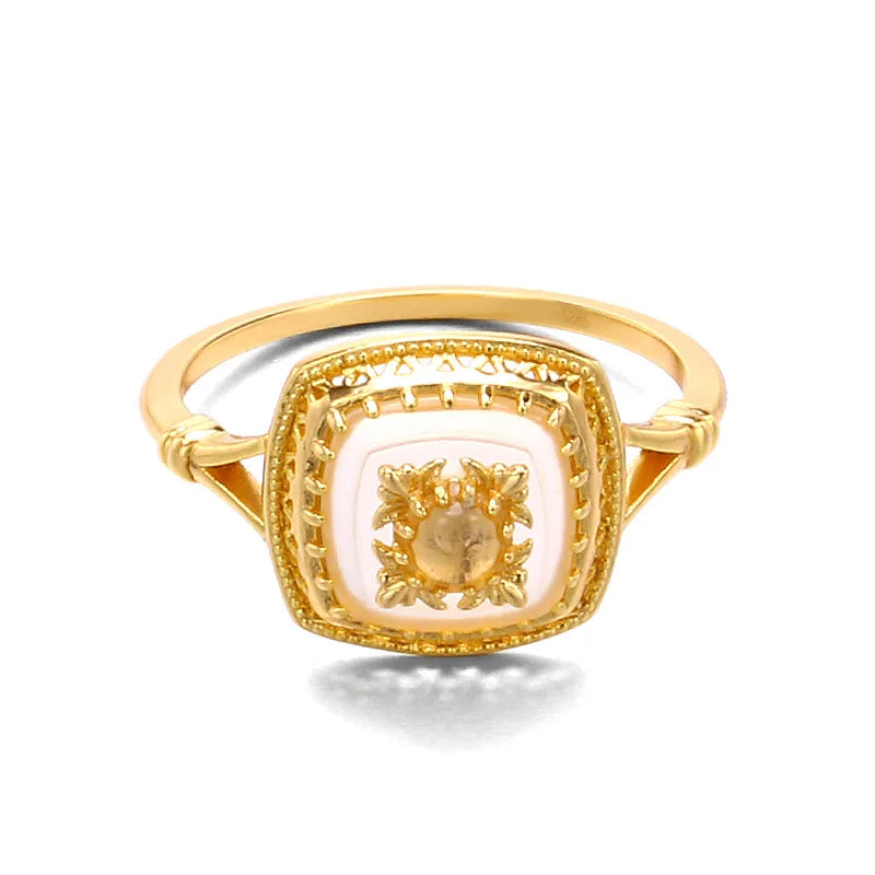 Natural chalcedony square ring with detailed gold metalwork and crystal accents