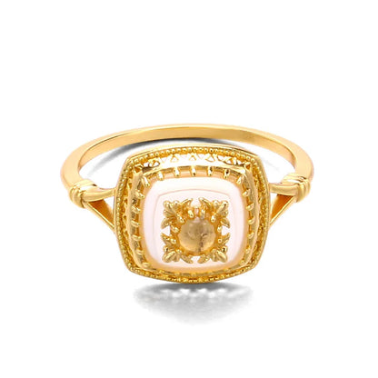 Natural chalcedony square ring with detailed gold metalwork and crystal accents