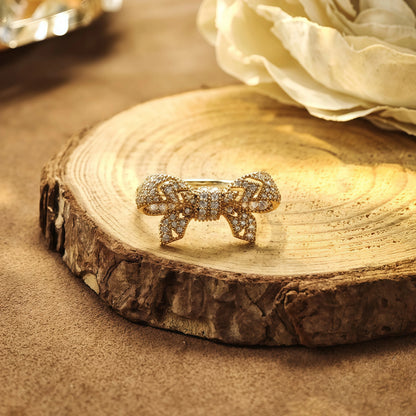 cubic zirconia bow ring displayed on jewelry stand