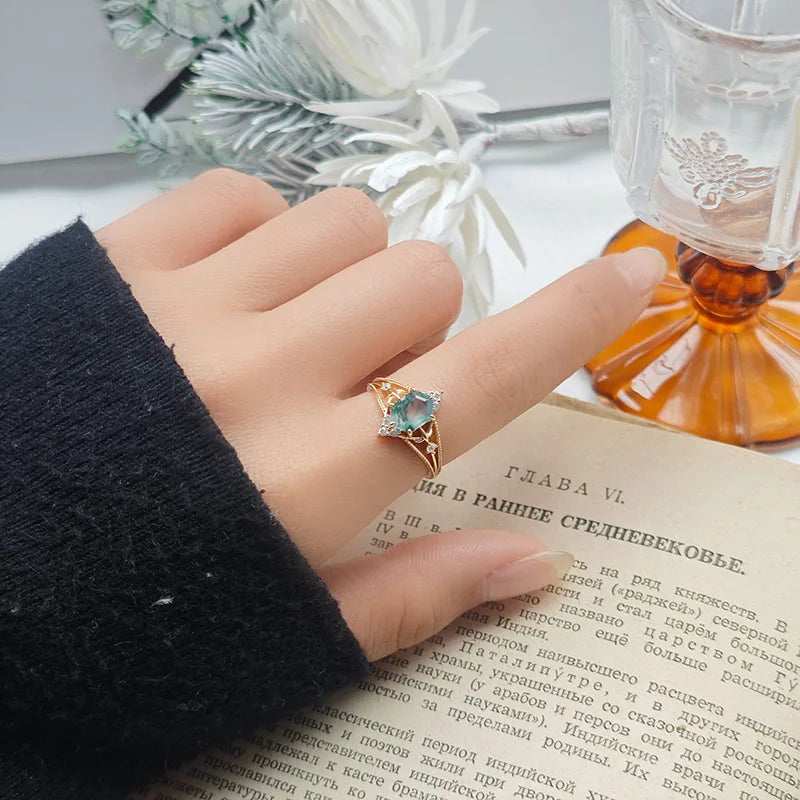 Green moss agate gemstone ring with natural fern-like inclusions