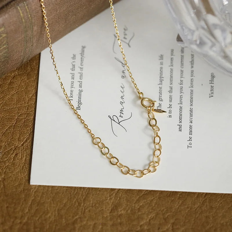 Lab-created ruby clover necklace displayed on a book