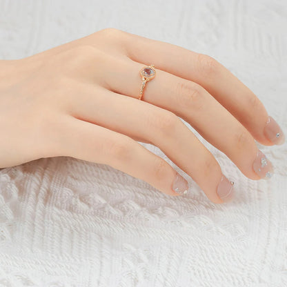 Lab-created alexandrite ring worn on hand