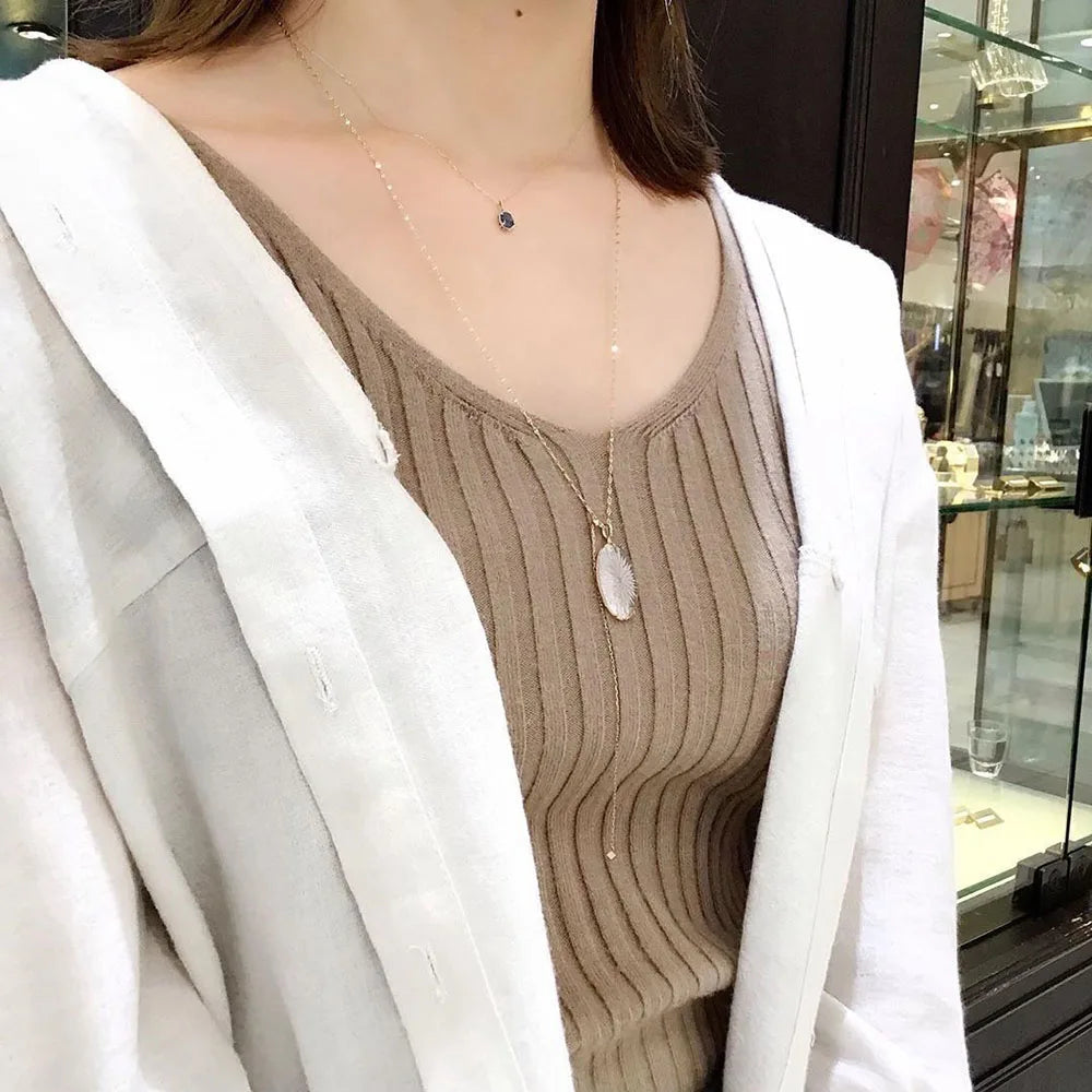white crystal necklace worn with 14K gold plated chain