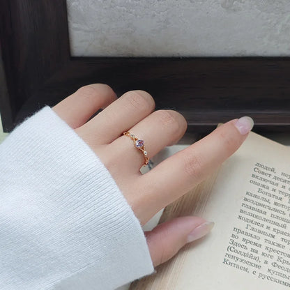 natural amethyst ring worn on hand with gold plated setting