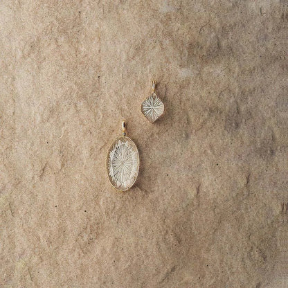 natural white crystal pendant necklace displayed on fabric