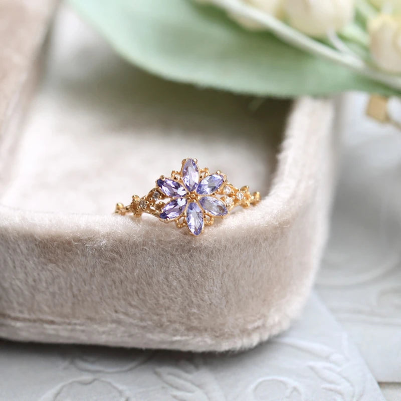 tanzanite snowflake ring worn on hand