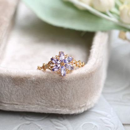tanzanite snowflake ring worn on hand