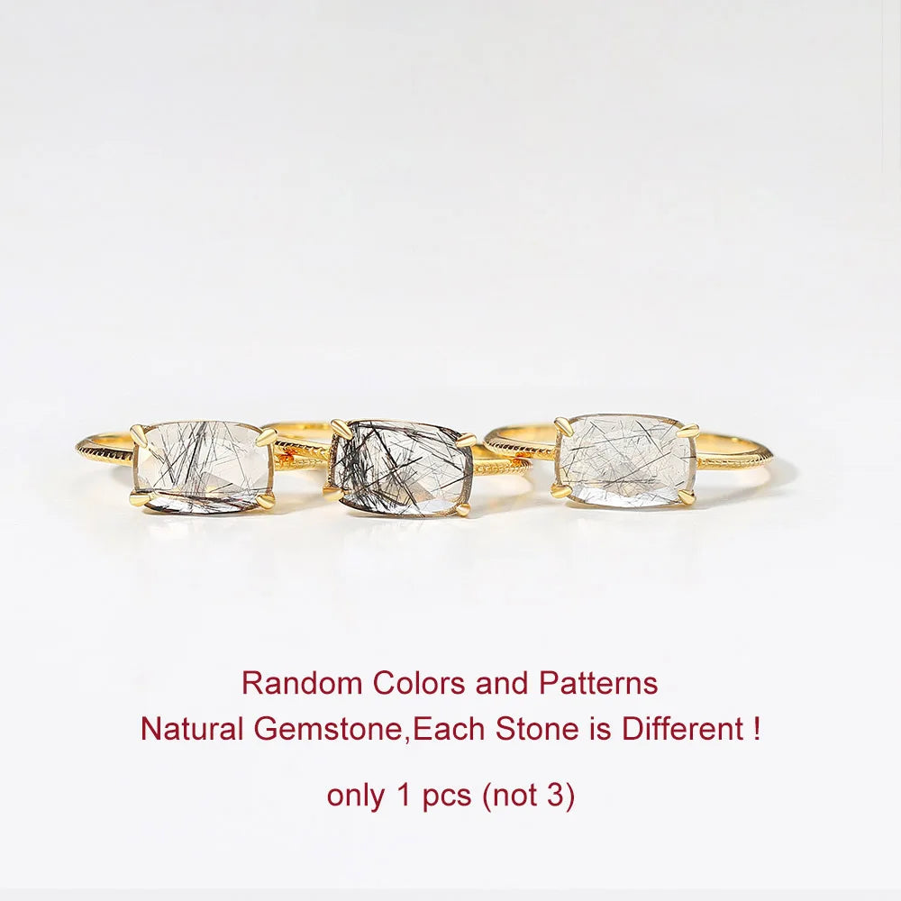 Gold Quartz Ring with three natural gemstones on a white background