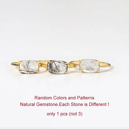 Gold Quartz Ring with three natural gemstones on a white background