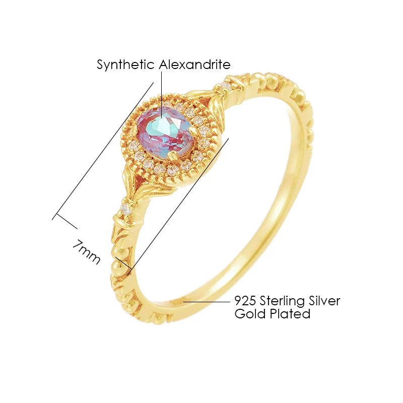Oval synthetic alexandrite ring with zircon accents in gold plated sterling silver