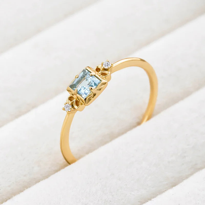 Natural aquamarine ring on white fabric in 14K gold plated silver