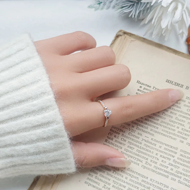 cubic zirconia heart ring worn on finger with gold plated band