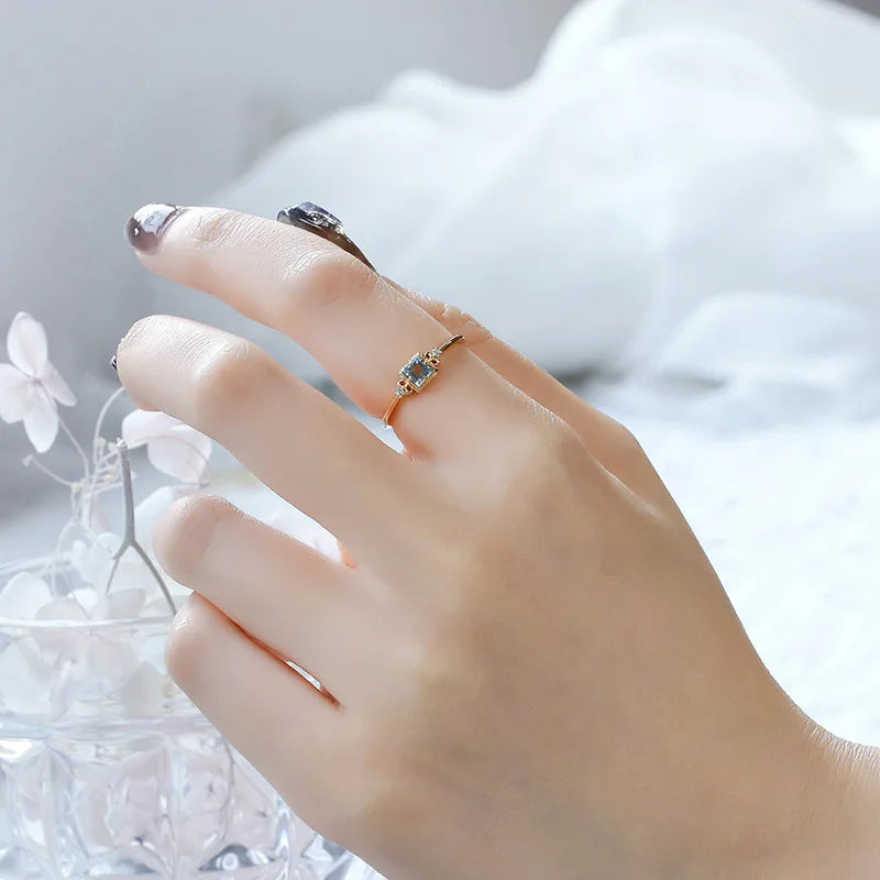Aquamarine ring worn on hand in 14K gold plated sterling silver
